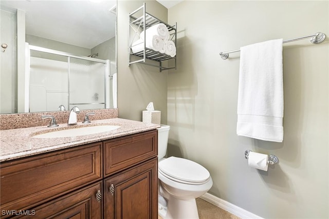 bathroom featuring walk in shower, vanity, and toilet