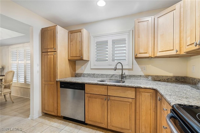 kitchen with appliances with stainless steel finishes, sink, light tile patterned floors, and light stone counters