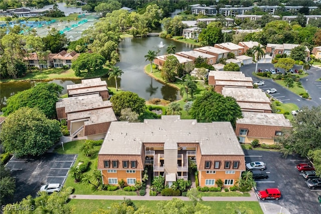 birds eye view of property featuring a water view