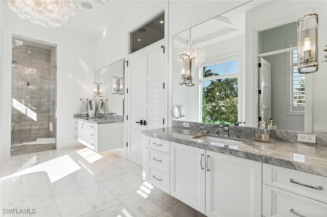 bathroom with vanity and walk in shower