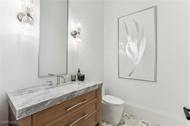 bathroom with vanity and toilet