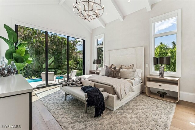 bedroom featuring access to exterior, light hardwood / wood-style flooring, high vaulted ceiling, and multiple windows