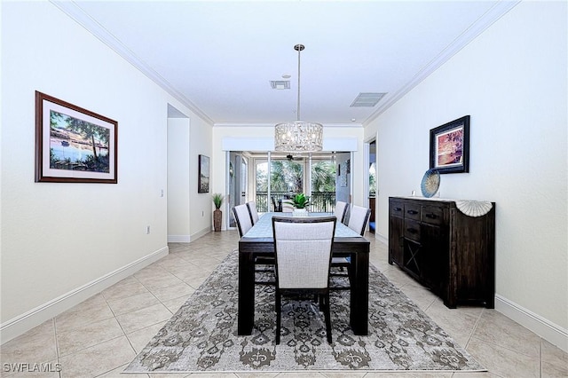 dining space with light tile patterned floors, an inviting chandelier, and ornamental molding