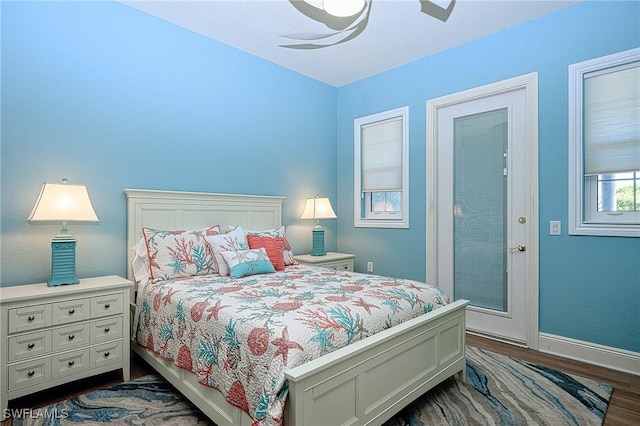 bedroom featuring ceiling fan and dark hardwood / wood-style floors