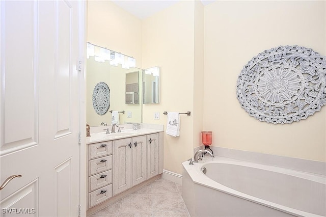 bathroom with vanity, tile patterned floors, and a tub