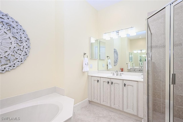 bathroom with vanity, tile patterned floors, and shower with separate bathtub