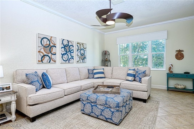 living room featuring ceiling fan, tile patterned floors, crown molding, and a textured ceiling