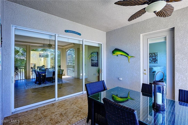 sunroom / solarium with ceiling fan