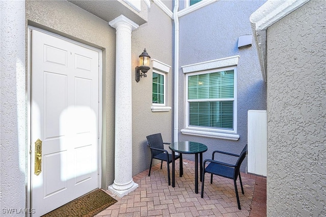 entrance to property with a patio