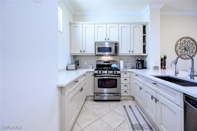 kitchen featuring appliances with stainless steel finishes, tasteful backsplash, sink, ornamental molding, and light tile patterned floors