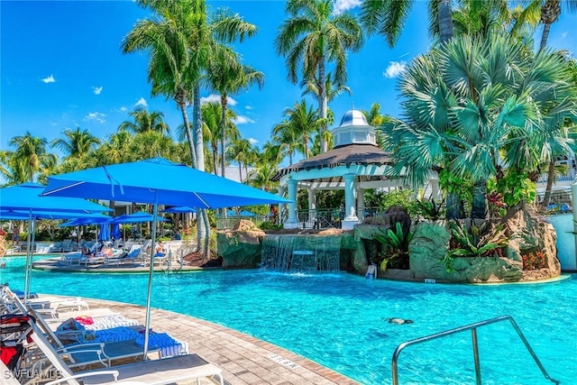 view of pool featuring a gazebo and pool water feature