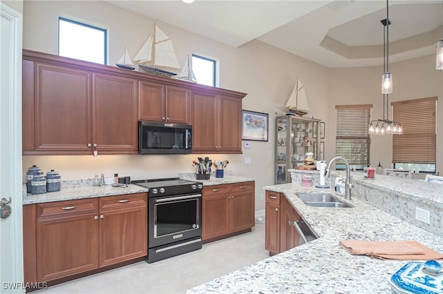 kitchen featuring hanging light fixtures, range with electric stovetop, light stone countertops, an inviting chandelier, and sink