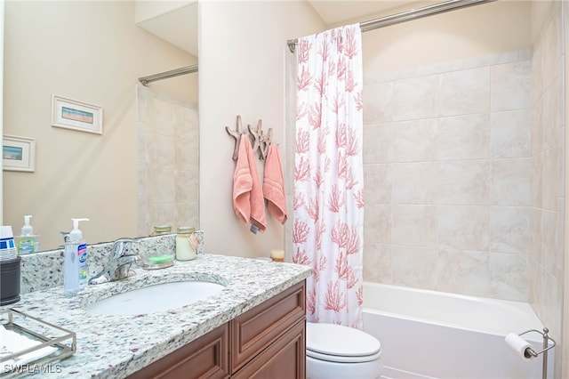 full bathroom with vanity, shower / bath combo with shower curtain, and toilet