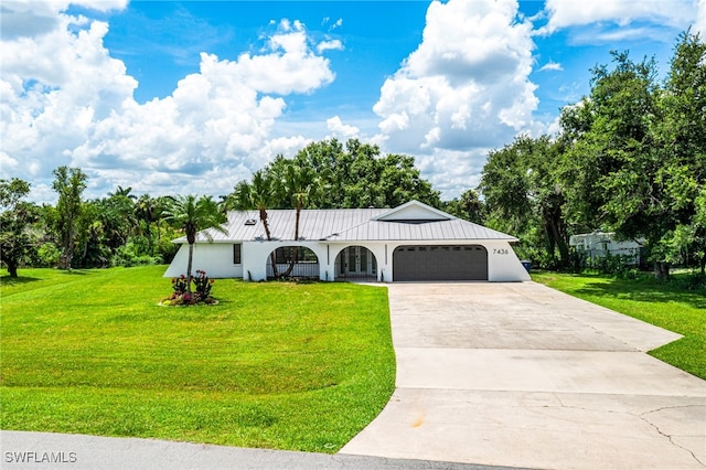 view of front facade with a garage and a front yard