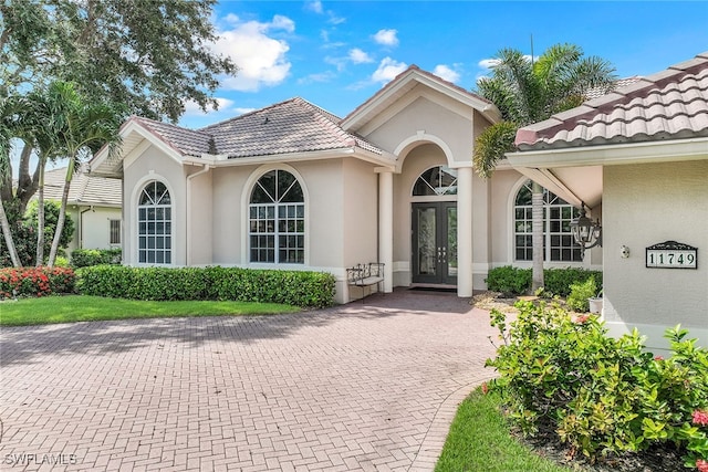 entrance to property featuring french doors