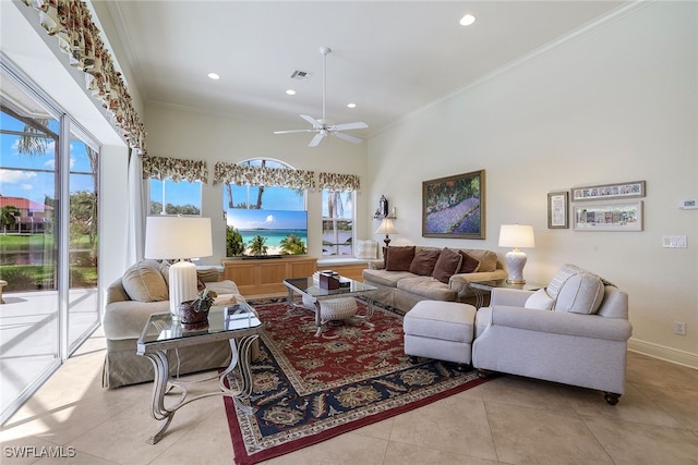 tiled living room with crown molding, ceiling fan, and plenty of natural light