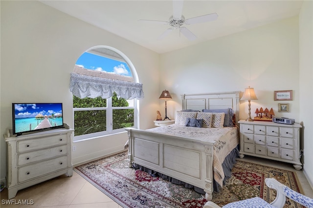 tiled bedroom with ceiling fan