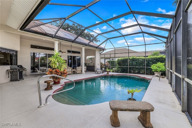 view of pool featuring ceiling fan, a patio, a grill, and a lanai