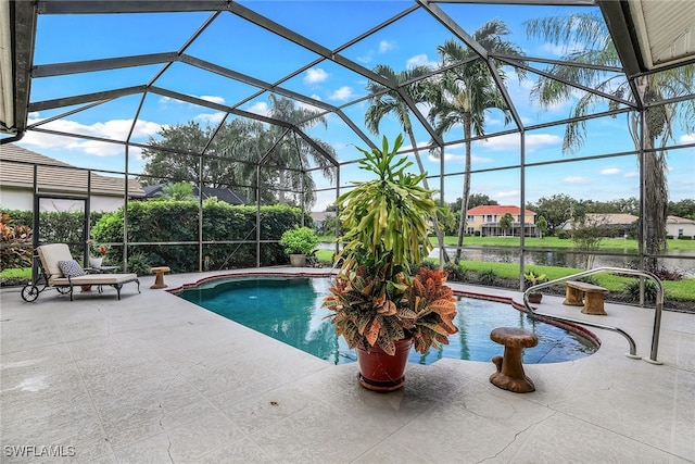 view of swimming pool with a patio and a lanai