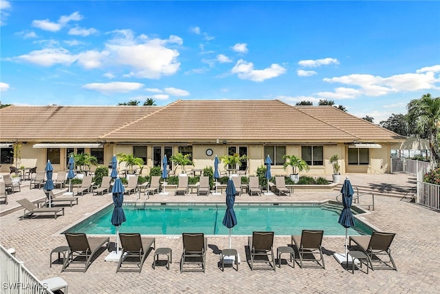 view of swimming pool featuring a patio area