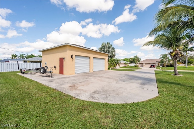 garage featuring a lawn