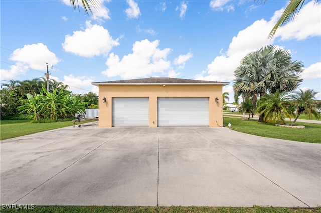 garage with a yard