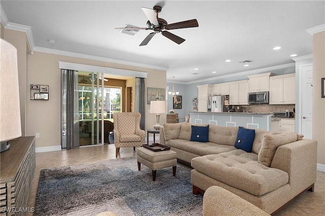 living room featuring light tile patterned floors, ceiling fan with notable chandelier, and ornamental molding