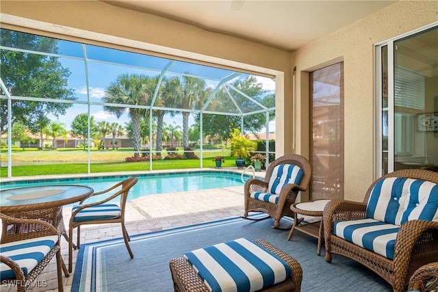 view of swimming pool with a patio area and glass enclosure