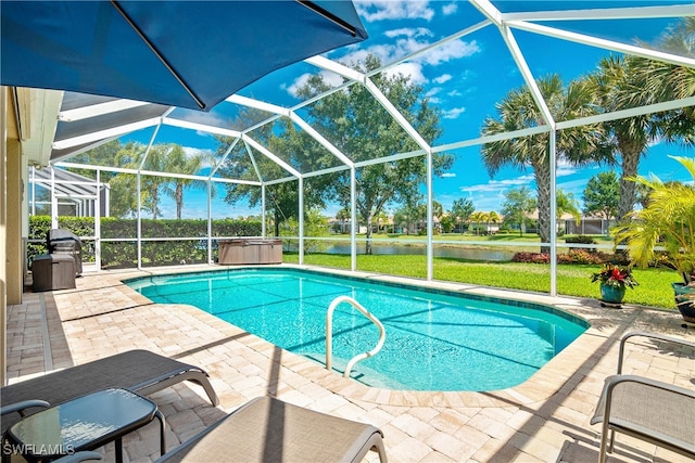 view of pool with a lanai, a water view, and a patio