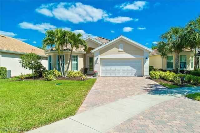 single story home with a garage and a front yard