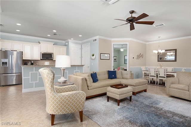 living room featuring ceiling fan with notable chandelier, light tile patterned floors, and ornamental molding