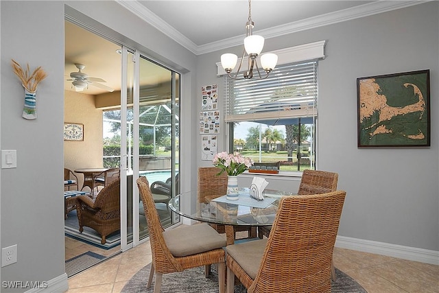 dining room with ceiling fan with notable chandelier, a healthy amount of sunlight, light tile patterned floors, and ornamental molding