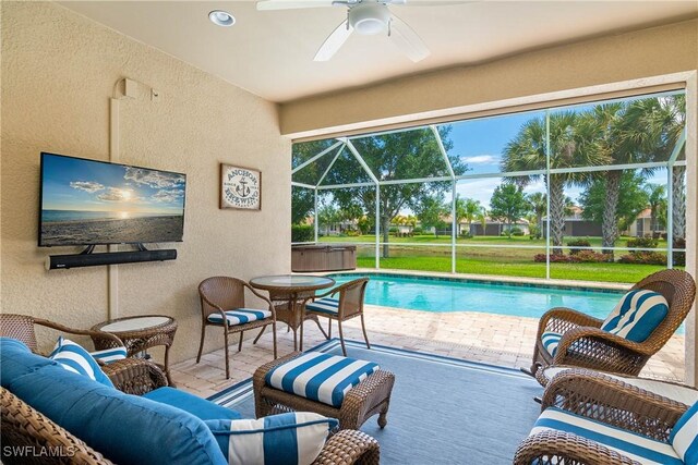 view of swimming pool featuring ceiling fan