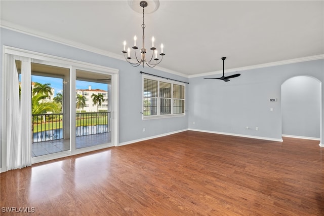 unfurnished dining area featuring ornamental molding, ceiling fan with notable chandelier, and hardwood / wood-style flooring