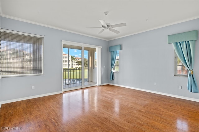 spare room with ornamental molding, ceiling fan, and hardwood / wood-style flooring