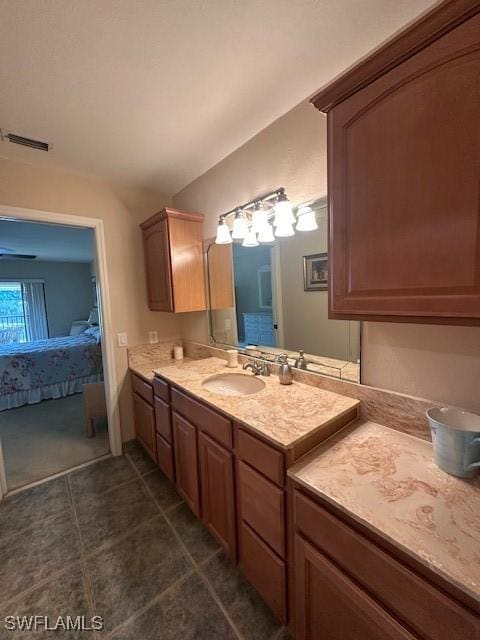 16679 Forest Blvd Unit 203, Fort Myers, FL 33908 - bathroom featuring connected bathroom, vanity, tile patterned floors, lofted ceiling, and visible vents