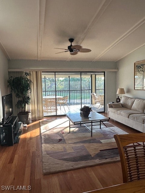 living room with ceiling fan and wood-type flooring