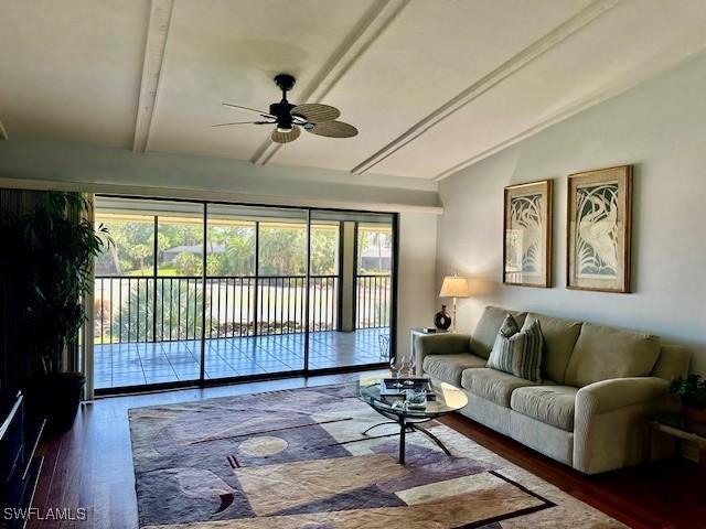 16679 Forest Blvd Unit 203, Fort Myers, FL 33908 - living area with ceiling fan, wood finished floors, and lofted ceiling
