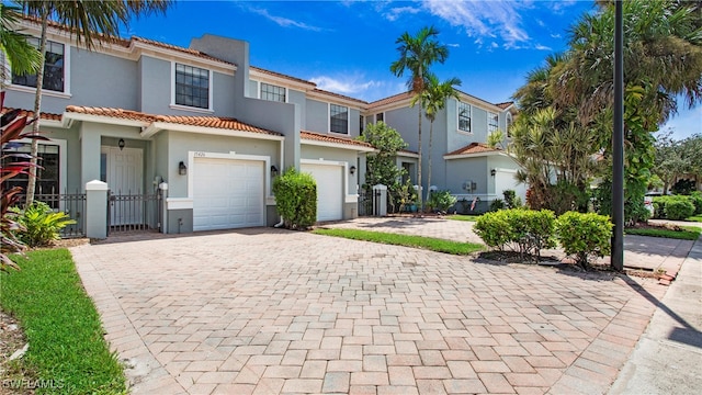 mediterranean / spanish-style house featuring a garage