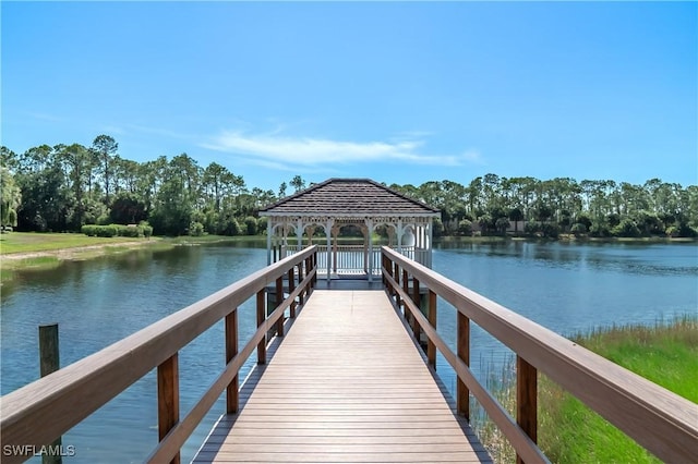 view of dock with a gazebo and a water view