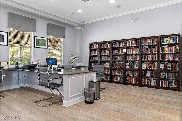 office space featuring ornamental molding and light wood-type flooring