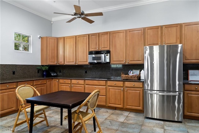 kitchen featuring tasteful backsplash, crown molding, ceiling fan, and appliances with stainless steel finishes