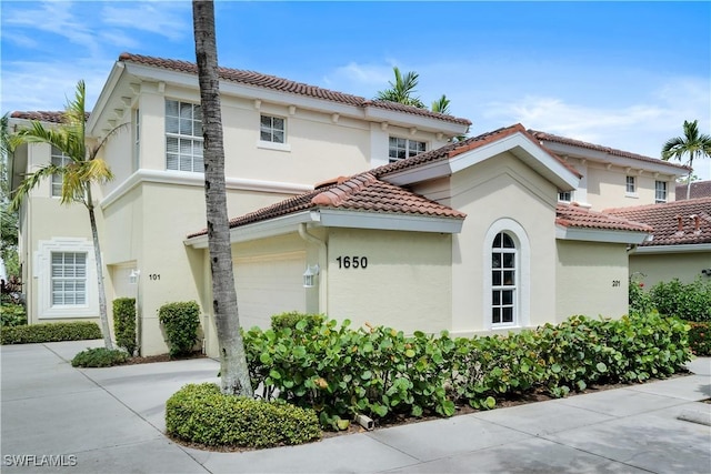 view of side of property featuring a garage