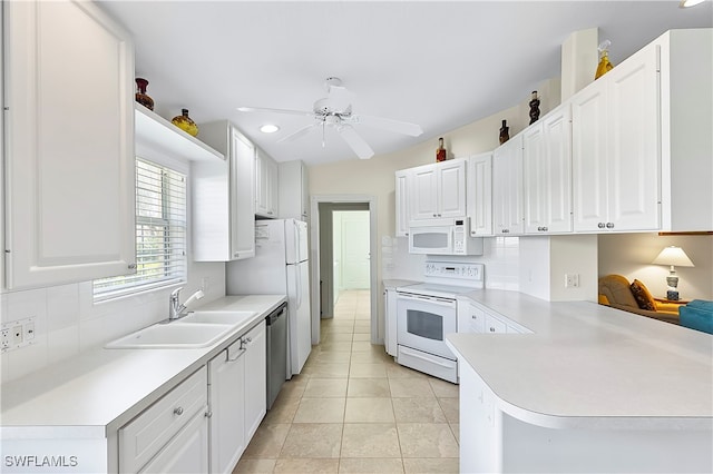 kitchen with kitchen peninsula, stove, sink, dishwasher, and white cabinets