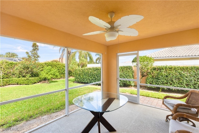 sunroom / solarium with ceiling fan