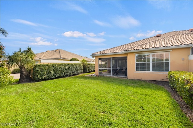 view of yard with a sunroom