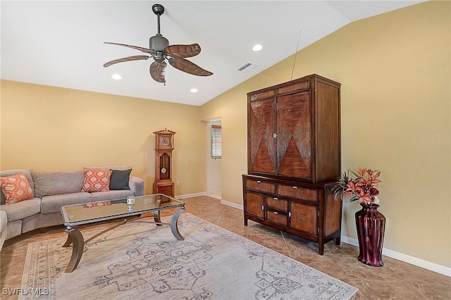 living room featuring ceiling fan and vaulted ceiling