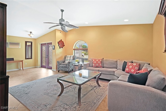 living room featuring vaulted ceiling, ceiling fan, and light tile patterned floors