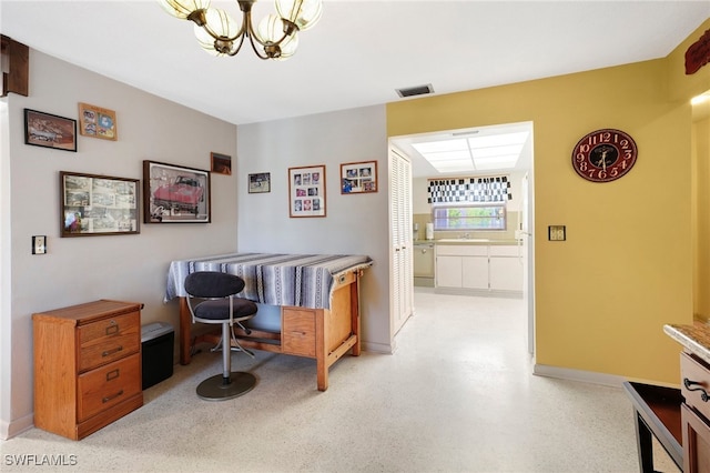 office space with an inviting chandelier