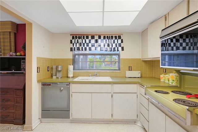 kitchen with dishwasher, white cabinetry, white electric stove, and backsplash